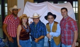 Photo of the Southern Horizons country music band dressed in country style outfits